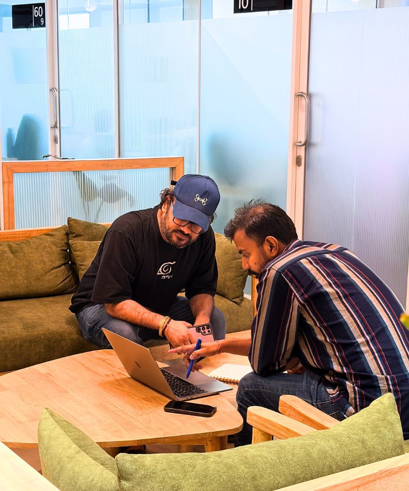 Immigration consultant reviewing a client's visa application documents in a modern office